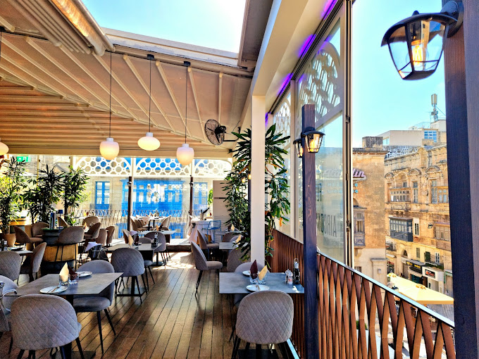 Enjoying a Spectacular View of Valletta's Bustling Streets from Merkanti Rooftop Restaurant
