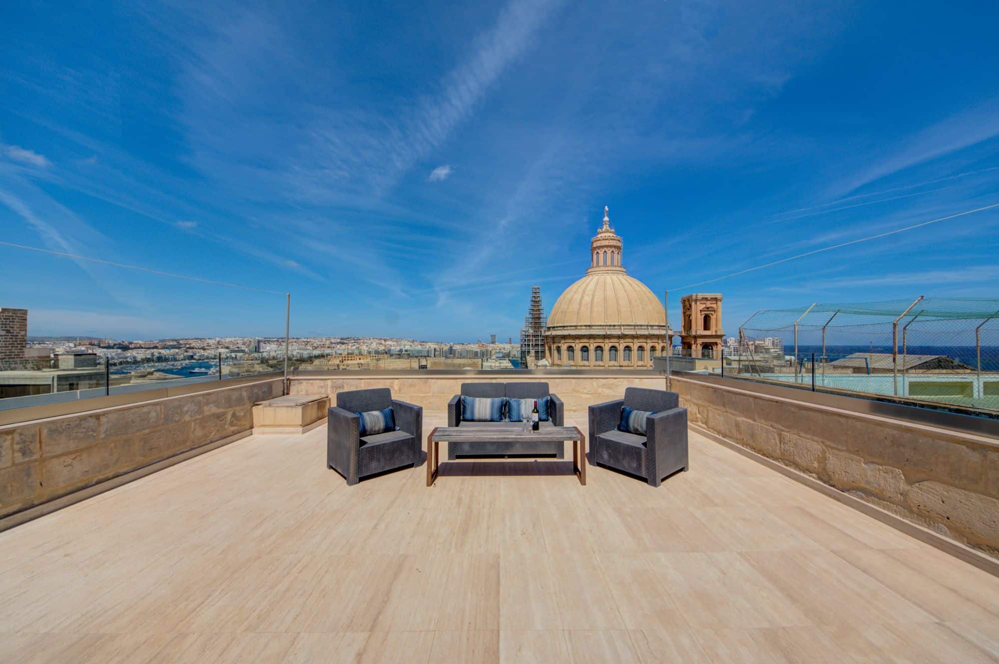 Panoramic view of Valletta's historic streets from the balcony of a Deluxe Double Room at The Manoel Boutique Hotel, showcasing the vibrant lifestyle and architectural beauty of Malta's capital city.