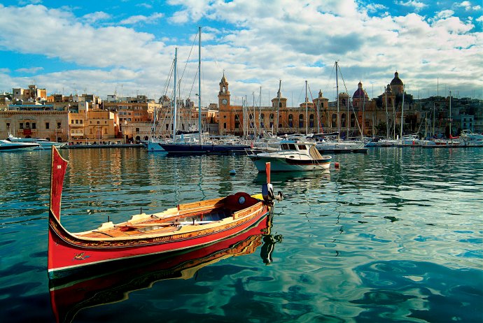 Birgu's Maritime Heritage: Traditional Luzzu Boats and Historic Architecture Grace the Waterfront