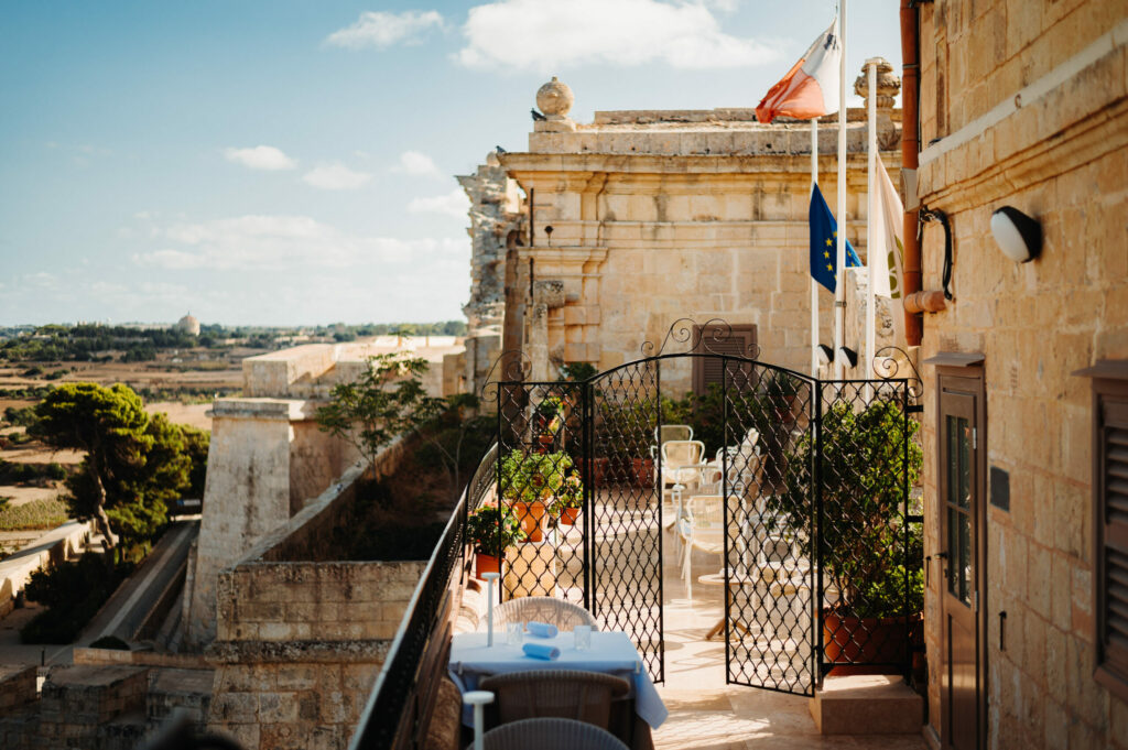 De Mondion at Xara Palace Relais & Chateaux, Mdina, Malta: A luxurious dining experience awaits at De Mondion restaurant, located within the historic walls of Xara Palace. The elegant interior features refined decor and panoramic views of the island, setting the stage for an unforgettable culinary journey. Guests indulge in gourmet dishes crafted from the finest local ingredients, complemented by impeccable service and an ambiance of Mediterranean elegance.




