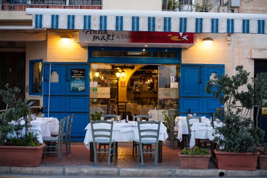 T'Anna Mari Restaurant in Marsaxlokk, Malta, offers a delightful selection of seafood cuisine with a focus on locally sourced ingredients, providing a picturesque setting for enjoying fresh catches during fishermen's feasts and seafood festivals.