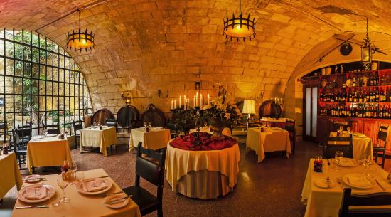 Bacchus Restaurant in Mdina, Malta, presents an elegant setting for wine tasting events, with a curated selection of wines complemented by traditional Maltese cuisine, offering a refined dining experience.