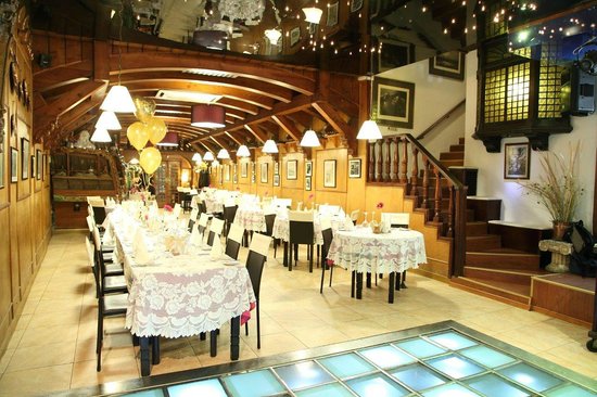 Ta' Marija Restaurant in Mosta, Malta, exudes charm with its traditional Maltese decor and a table set with delectable local dishes, offering a delightful dining experience.