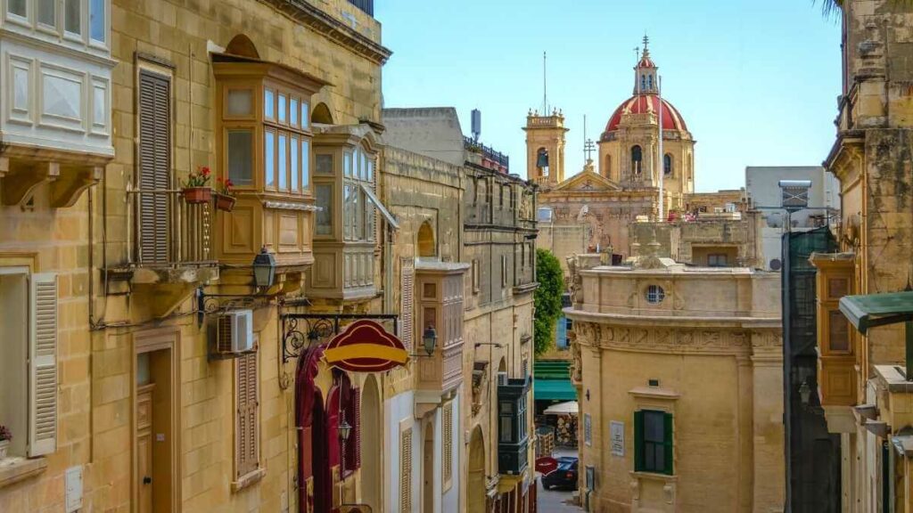 Charming streets of Victoria, Gozo with stunning church views.