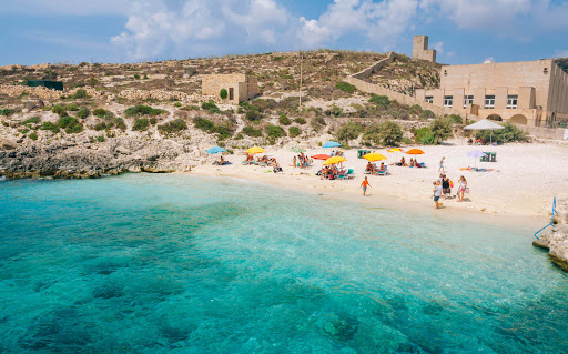 Scenic view of Hondoq ir-Rummien Bay with its pebbly beach and clear blue waters in Gozo.